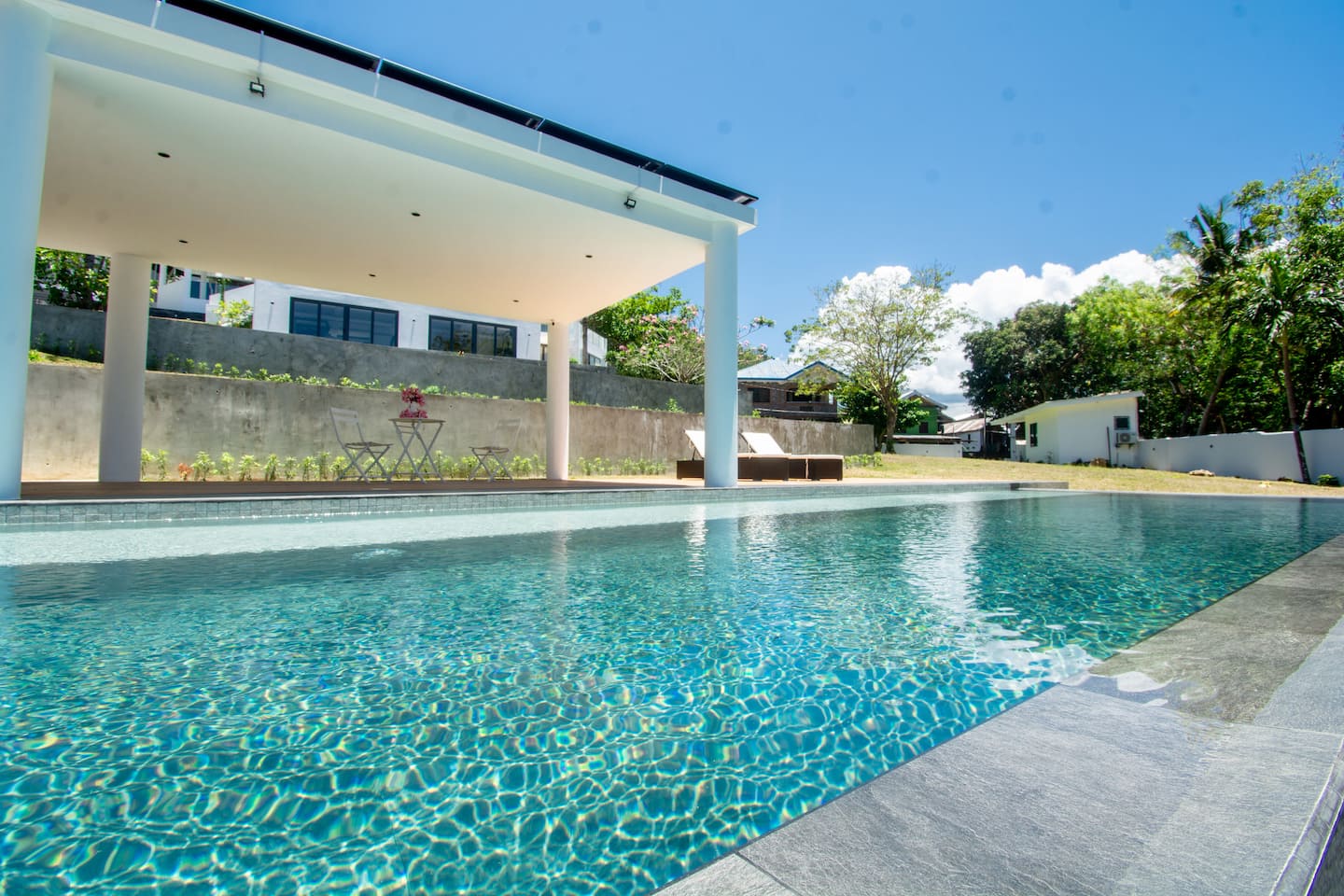 Infinity pool with shaded cabana