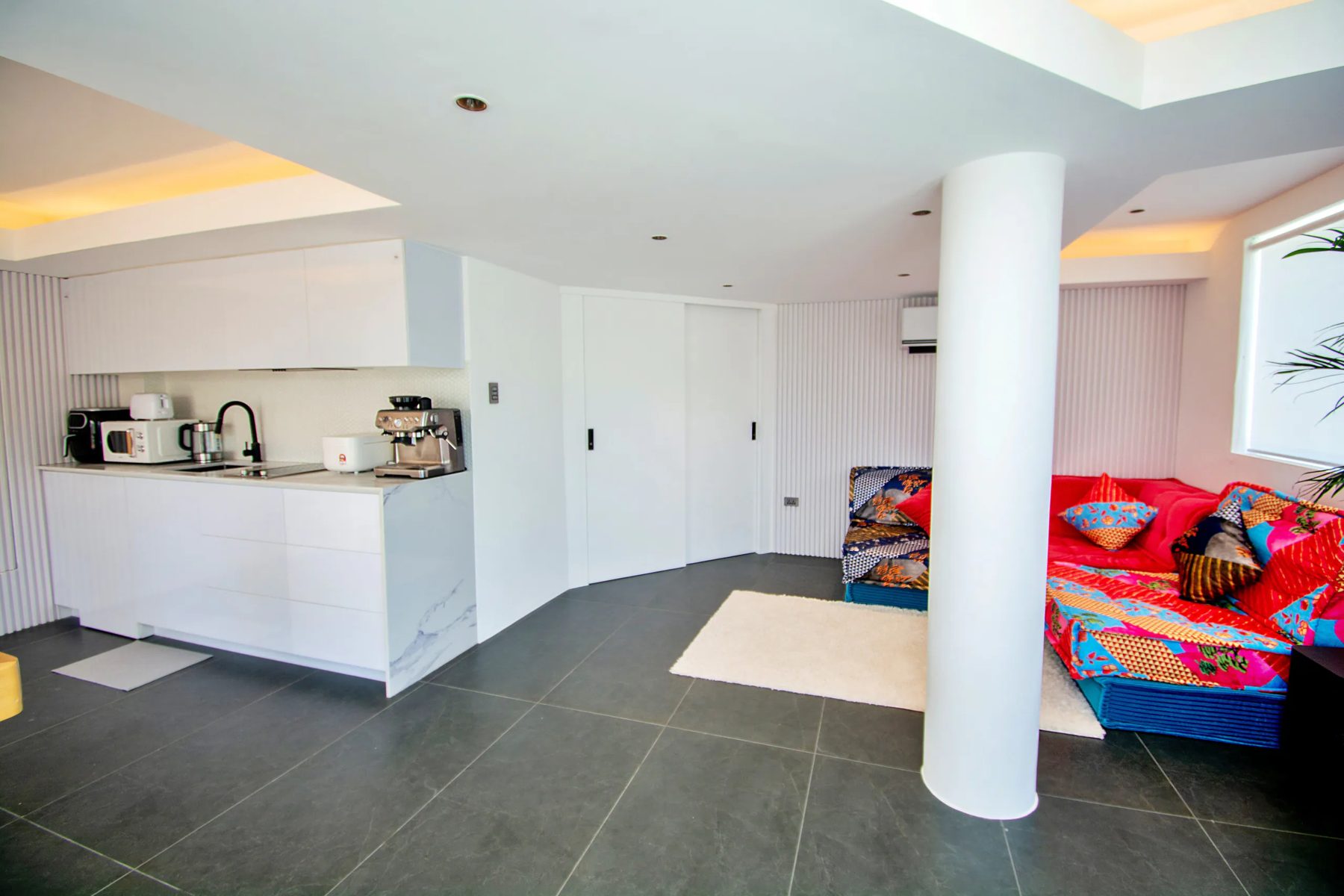 Garden Suite living area and kitchenette with espresso machine